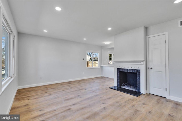 unfurnished living room featuring light hardwood / wood-style floors