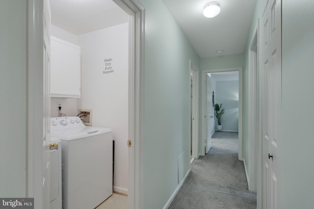 laundry area with cabinets, light colored carpet, and independent washer and dryer