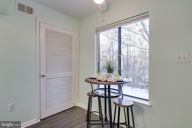 dining area with dark hardwood / wood-style floors