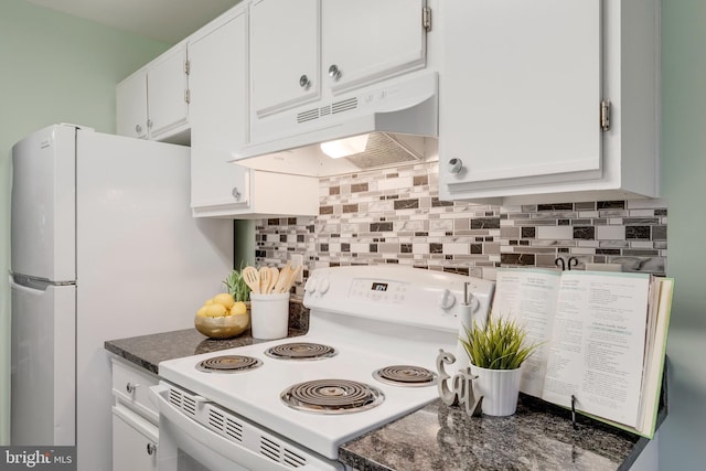 kitchen with tasteful backsplash, white cabinets, and white electric range oven