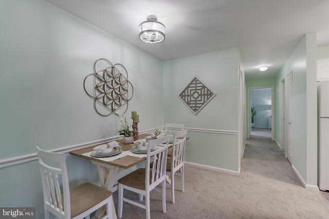 view of carpeted dining space