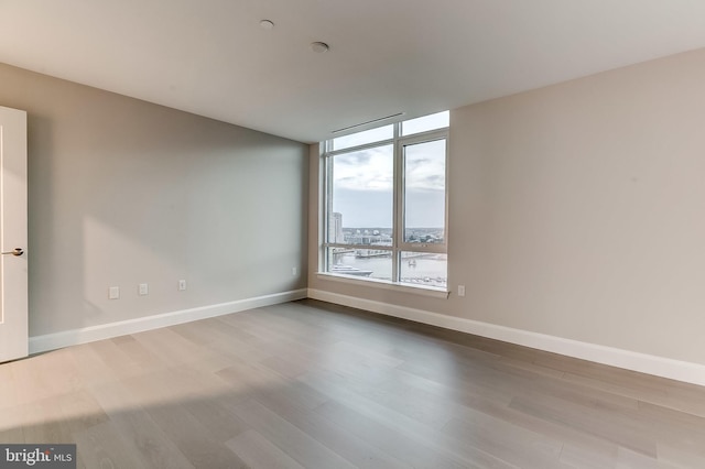 empty room featuring hardwood / wood-style flooring