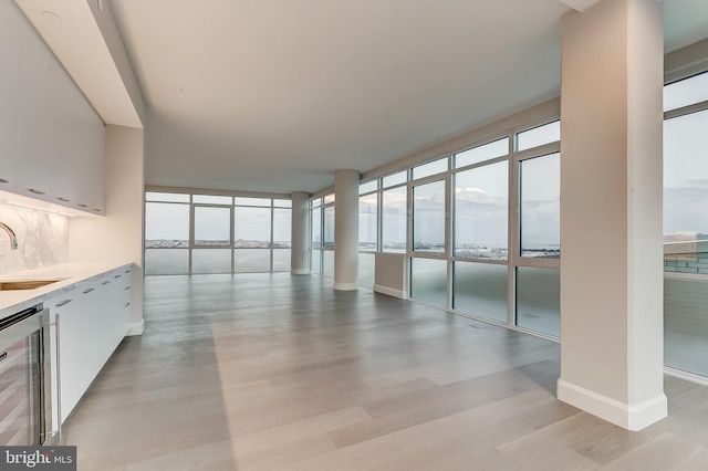 interior space with sink and beverage cooler