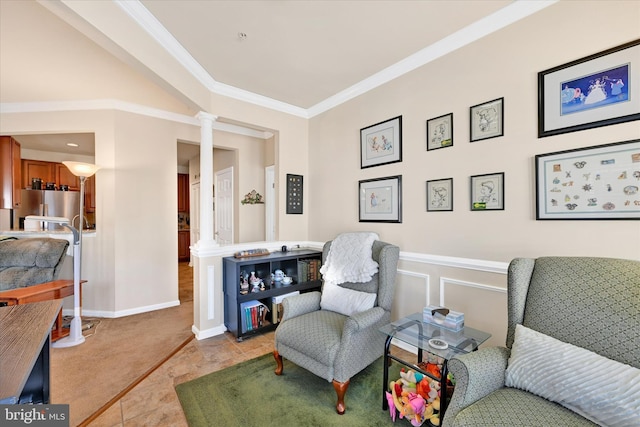 sitting room featuring decorative columns, crown molding, and light tile patterned floors