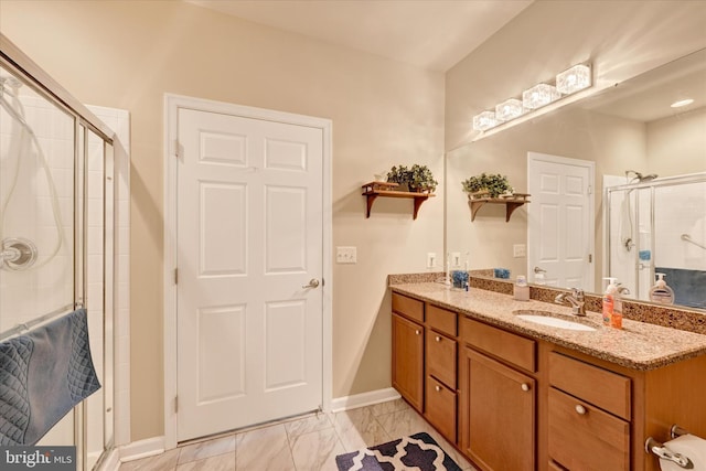 bathroom with vanity and an enclosed shower