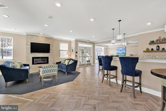 interior space with french doors, decorative light fixtures, ornamental molding, a fireplace, and light parquet floors