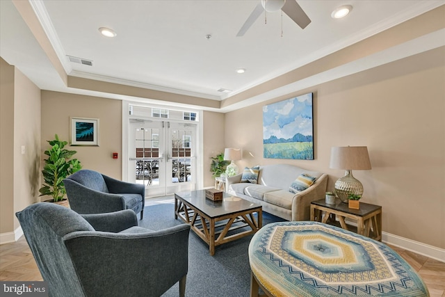 living room featuring ceiling fan, crown molding, french doors, and light parquet floors