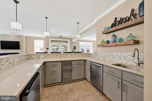 kitchen featuring sink, decorative light fixtures, gray cabinets, dishwasher, and decorative backsplash