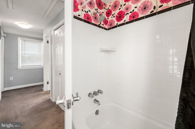 bathroom featuring tiled shower / bath combo