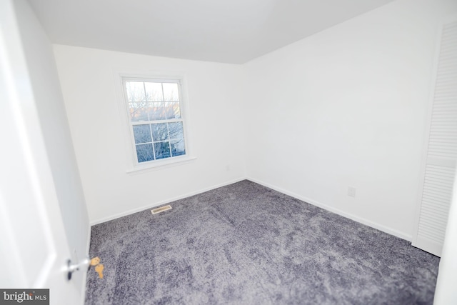 unfurnished room with carpet floors