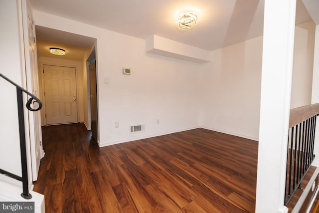 unfurnished room featuring dark hardwood / wood-style flooring