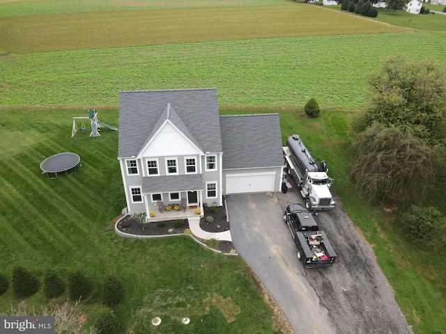 birds eye view of property with a rural view