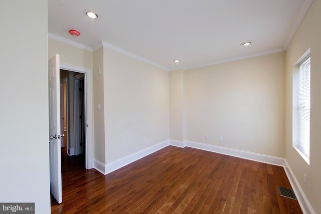 unfurnished room featuring dark wood finished floors, a healthy amount of sunlight, and baseboards