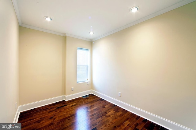 unfurnished room with visible vents, crown molding, dark wood-type flooring, and baseboards