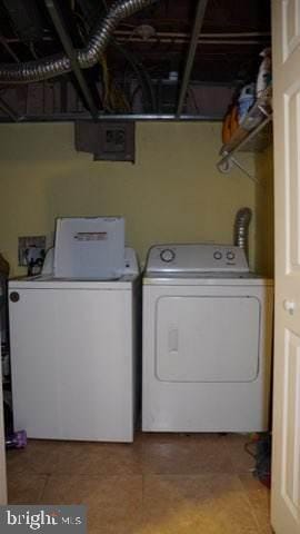 clothes washing area with independent washer and dryer