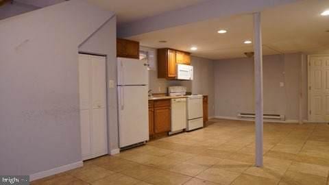 kitchen with white appliances and a baseboard heating unit