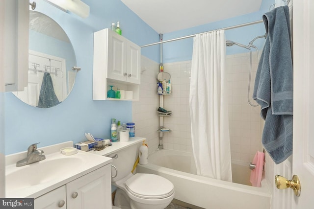 full bathroom with shower / bath combo, vanity, and toilet