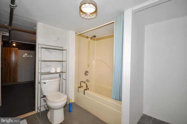 bathroom featuring tile patterned floors, shower / washtub combination, and toilet