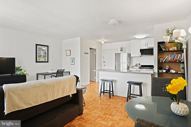 living room with light parquet flooring