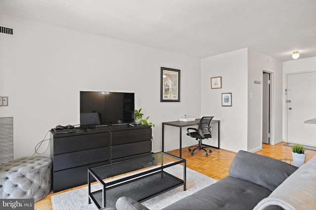 living room featuring light parquet floors