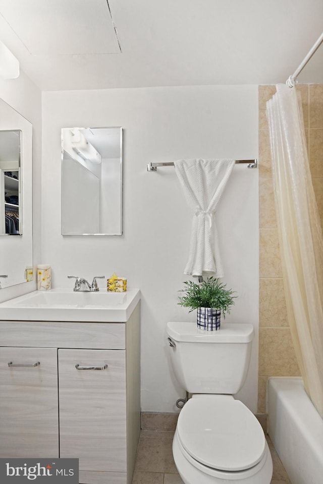 full bathroom with vanity, toilet, tile patterned flooring, and shower / tub combo