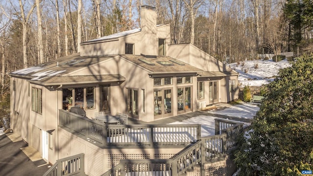 view of snow covered deck