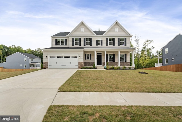 view of front facade featuring a garage, a porch, and a front yard