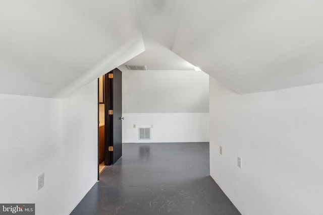 bonus room with vaulted ceiling