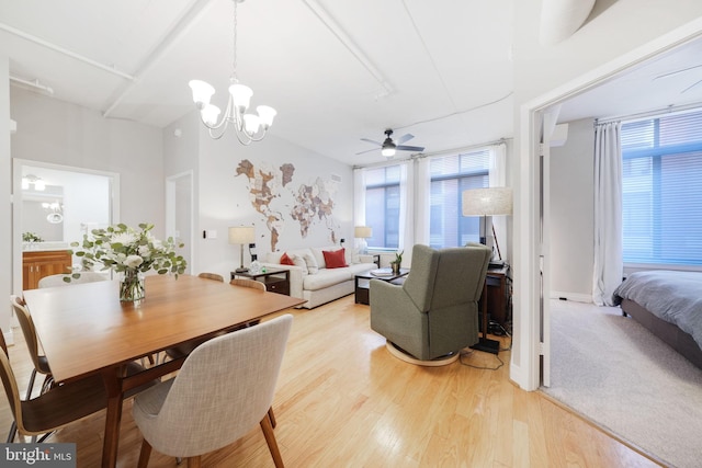 dining area featuring hardwood / wood-style flooring and a notable chandelier