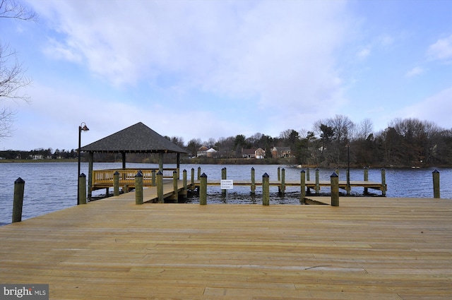 dock area featuring a gazebo and a water view