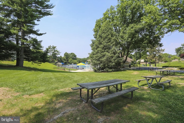 view of home's community with a yard