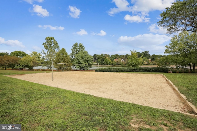 surrounding community with a yard and volleyball court