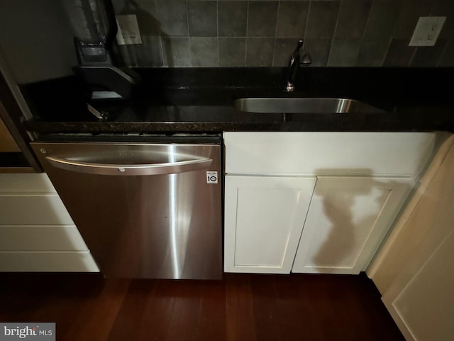 kitchen featuring sink, dishwasher, dark hardwood / wood-style floors, tasteful backsplash, and white cabinets