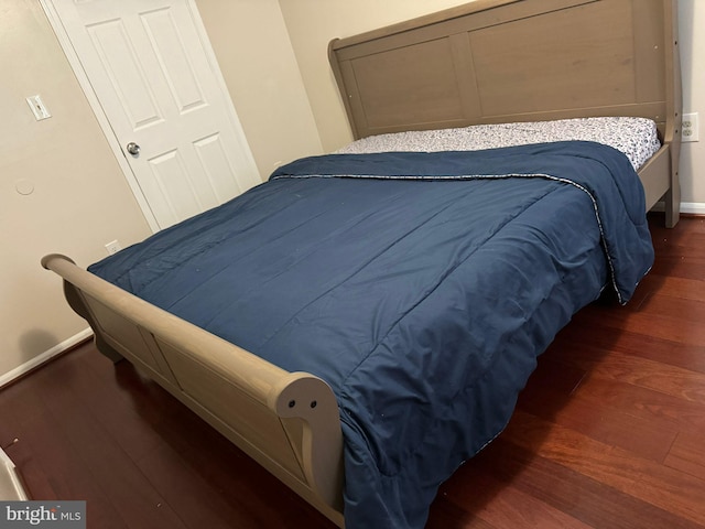 bedroom featuring dark hardwood / wood-style flooring