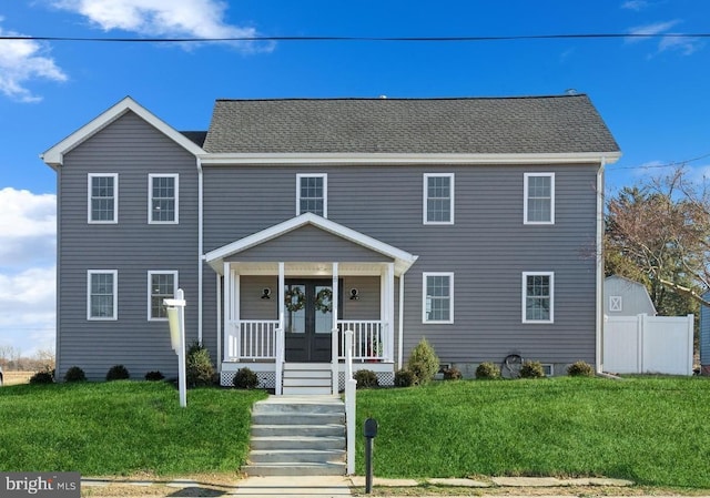 view of front facade featuring a porch and a front yard