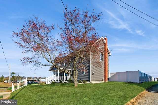 exterior space with a lawn and covered porch