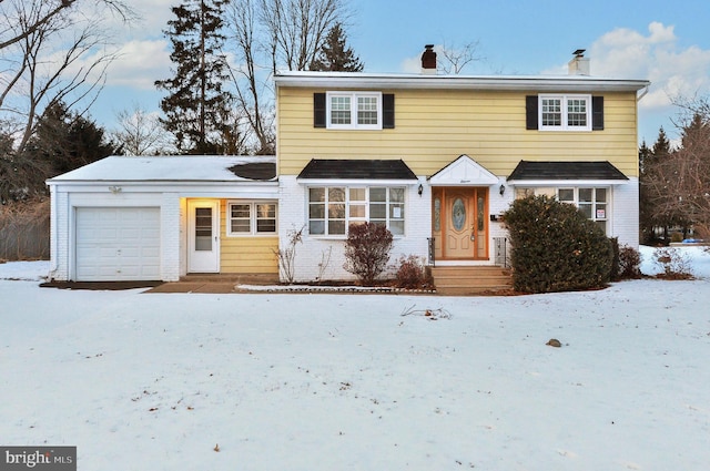 view of front of property with a garage