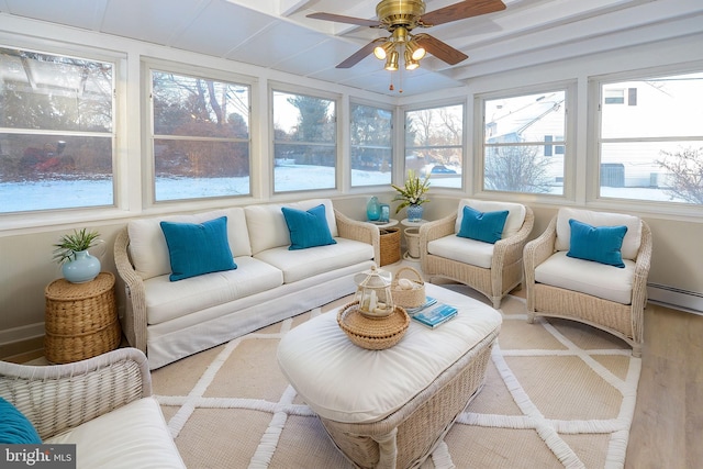 sunroom / solarium with ceiling fan and a healthy amount of sunlight