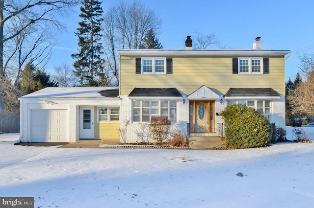 view of front of property with a garage