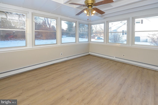 unfurnished sunroom featuring ceiling fan