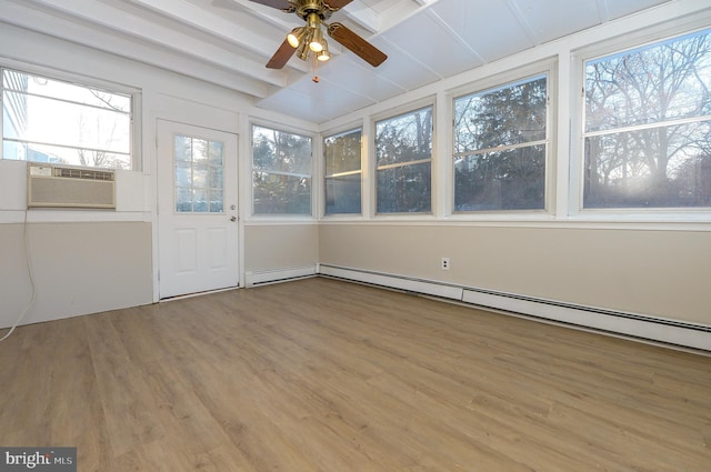 unfurnished sunroom featuring cooling unit, a baseboard radiator, and ceiling fan