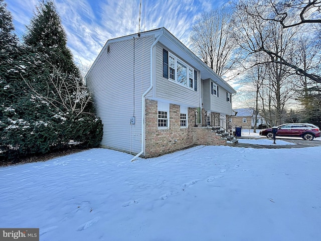 view of snow covered property