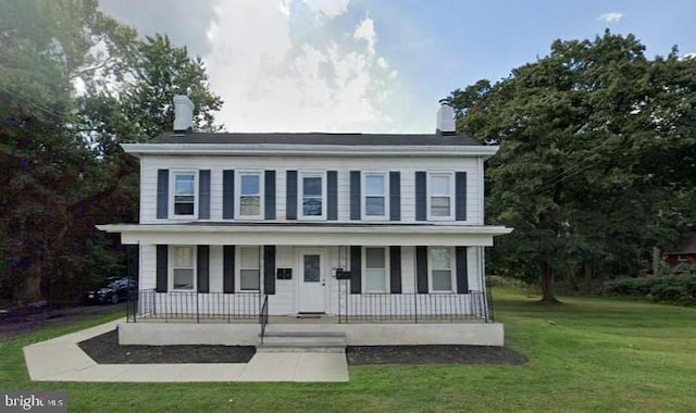 view of front facade with a porch and a front yard