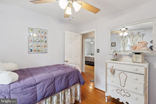 bedroom with hardwood / wood-style flooring and ceiling fan