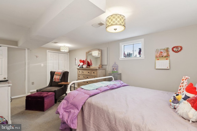 carpeted bedroom with a closet