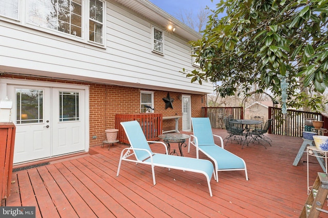 wooden terrace featuring french doors