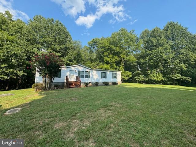 view of front of home with a front yard