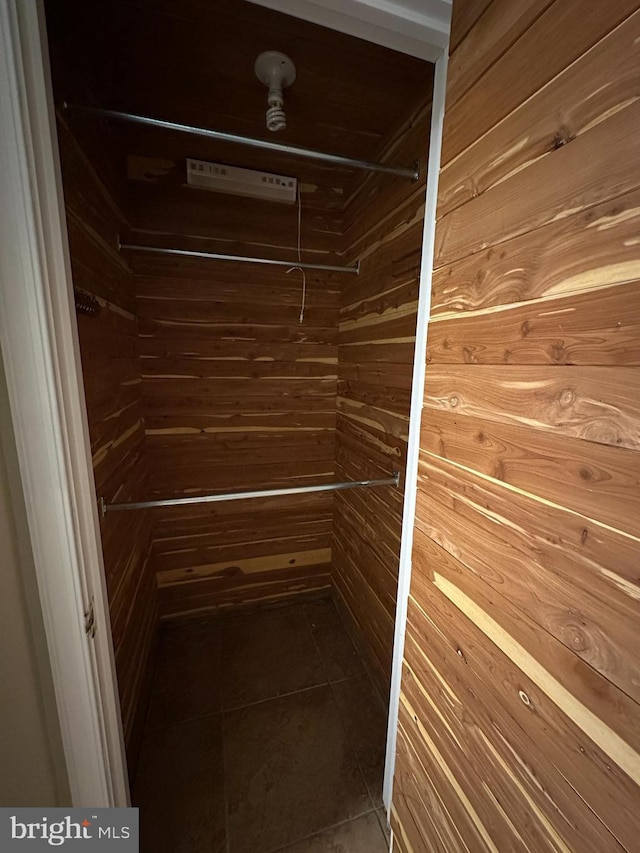 walk in closet featuring tile patterned flooring