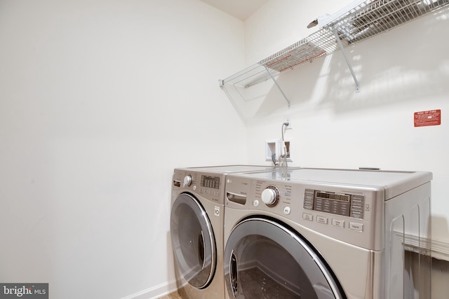 laundry area featuring washing machine and dryer