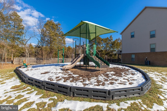 snow covered playground featuring central AC unit